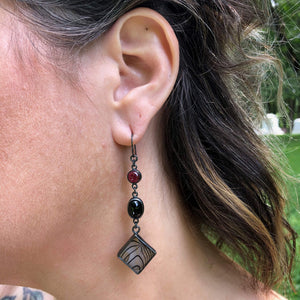 Garnet, Black Star Dioptase + Garnet Dangle Earrings. Set in oxidized sterling silver. "Betwixt + Between" collection by Alex Lozier Jewelry + Salicrow.