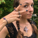 Amethyst Amulet Bracelet with Handmade Chain on wrist. Worn with the Star Child Ring, Amethyst Amulet Ring + 4 Directions Ring.  Part of the Season of the Witch Collection by Alex Lozier Jewelry.
