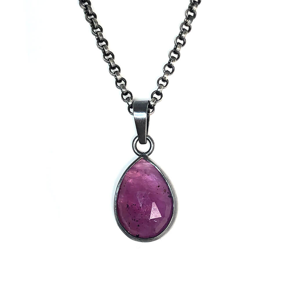 Rose cut pink sapphire teardrop charm pendant.  Set in oxidized sterling silver.  Hearts on Fire collection.  Handmade by Alex Lozier Jewelry.